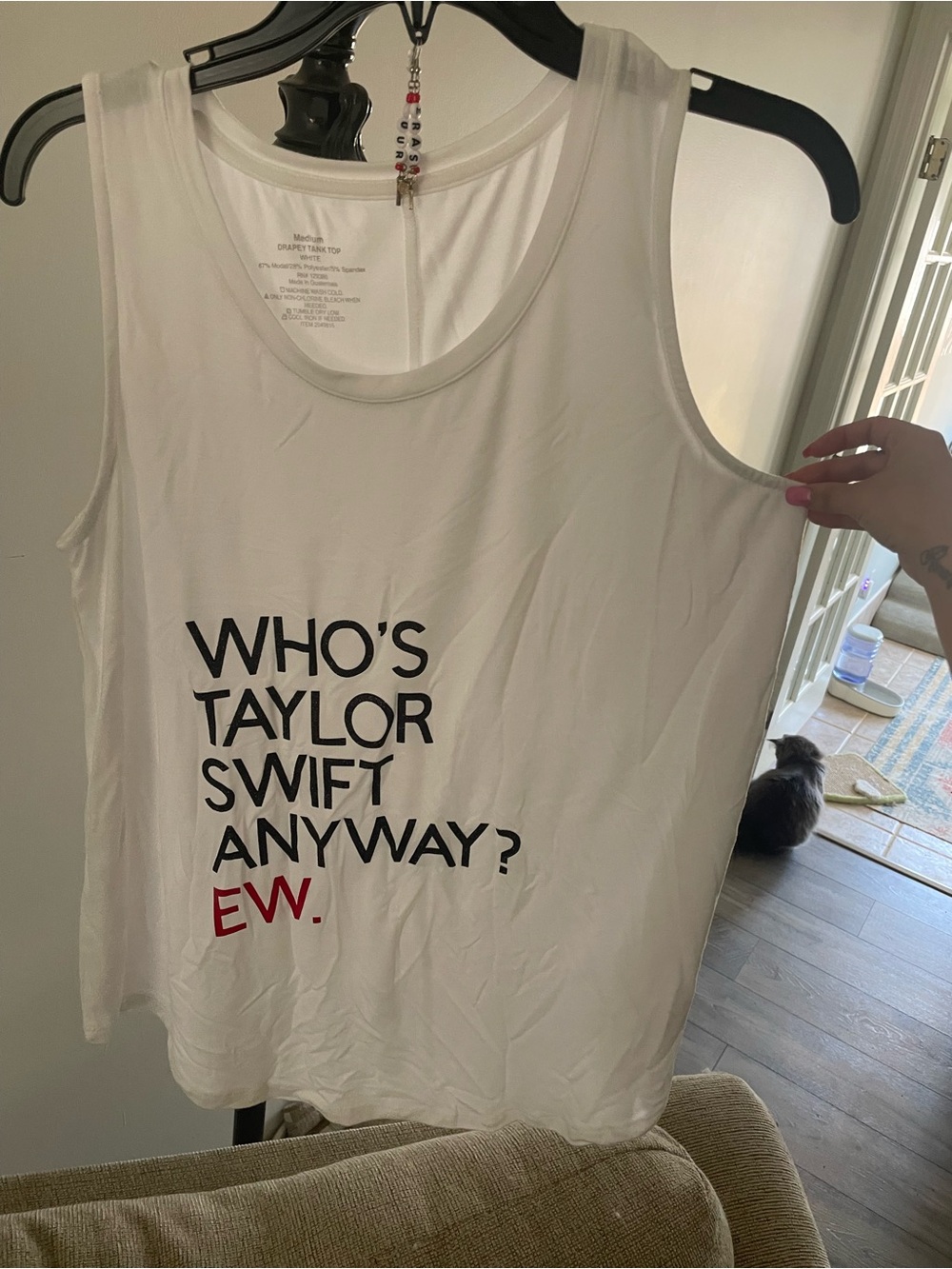 WHO'S TAYLOR SWIFT ANYWAY? Graphic White Tank Top with eras tour earrings